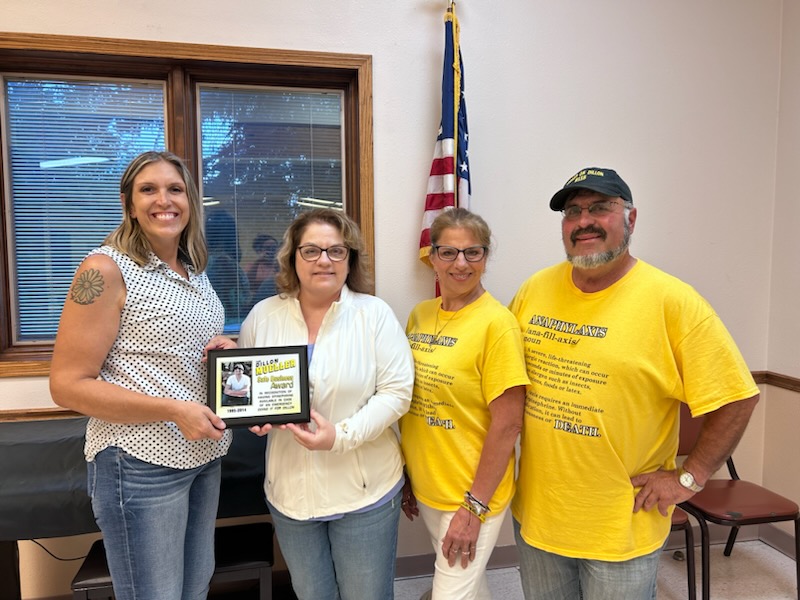 Group photo with plaque